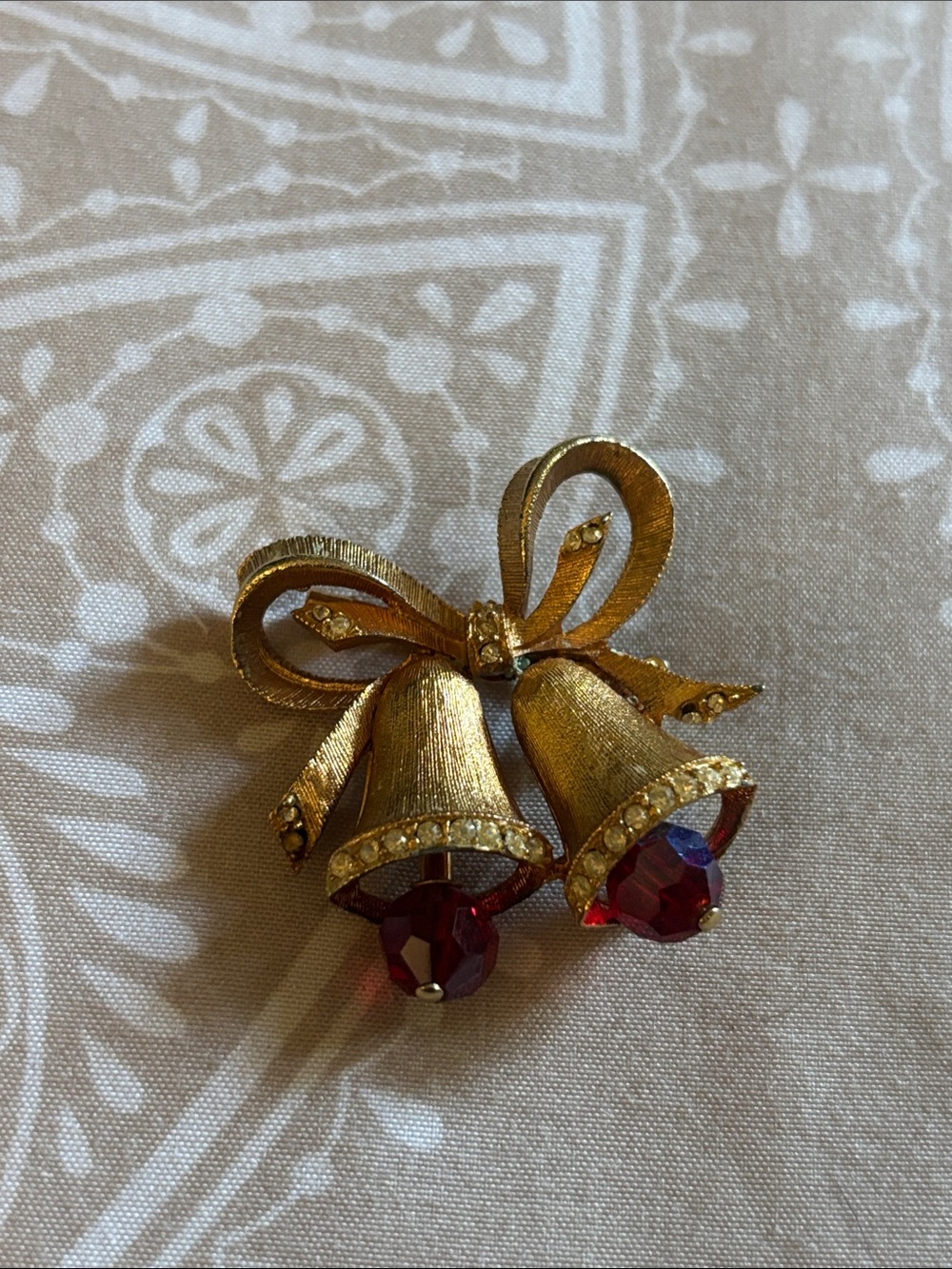 Gold Bow Bell Brooch with Red Crystal Drops